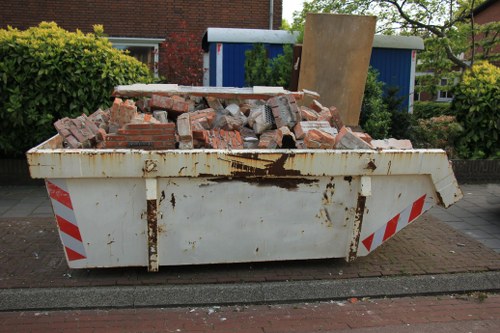 Team members performing rubbish clearance in South West London